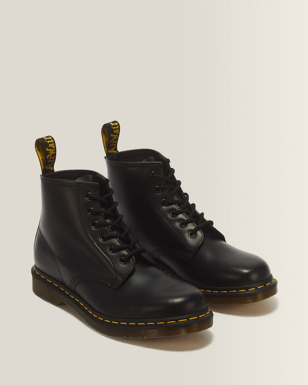 Dr. Martens 101 Yellow Stitch Smooth Leather Ankle Boots in Black - 3/4 angle pair
